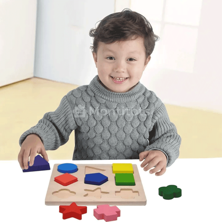 one boy with shape puzzles